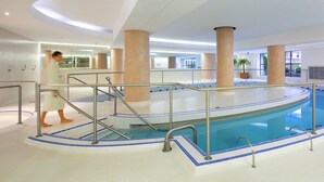 An indoor swimming pool with a tiled floor, metal railings, and a person walking. - Casa Vama Pool Private Cinema (Amelie-les-Bains-Palalda)