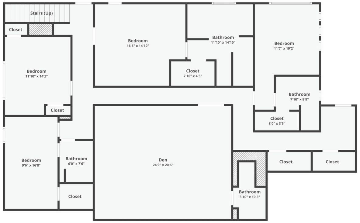 A floor plan with multiple bedrooms, bathrooms, and closets.