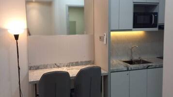 Fridge, microwave, stovetop, cookware/dishes/utensils