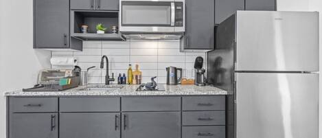 Fridge, microwave, stovetop, coffee/tea maker