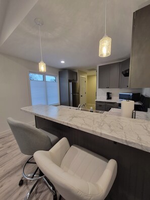 Private kitchen - Cozy 1-bedroom duplex in Greenfield with AC. (Greenfield)