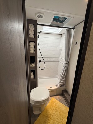 Shower, hair dryer, towels, soap
