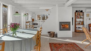 A modern interior with a dining area, a fireplace, and a bookshelf. - "Verene" - 725m from the sea by Interhome (Rudkøbing)
