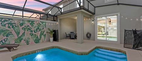 A pool area with a 4 ft depth, a covered patio, and a view of the backyard.