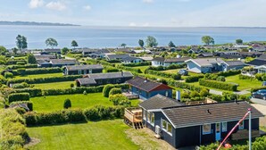 A coastal residential area with houses, green lawns, and a view of the sea. - "Teofan" - 325m from the sea by Interhome (Ebberup)