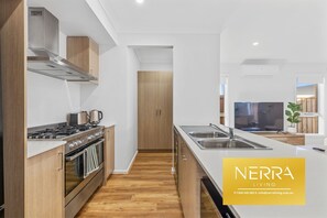 Private kitchen - Modern 3-bedroom, 3-bathroom home with premium amenities throughout. (Officer)