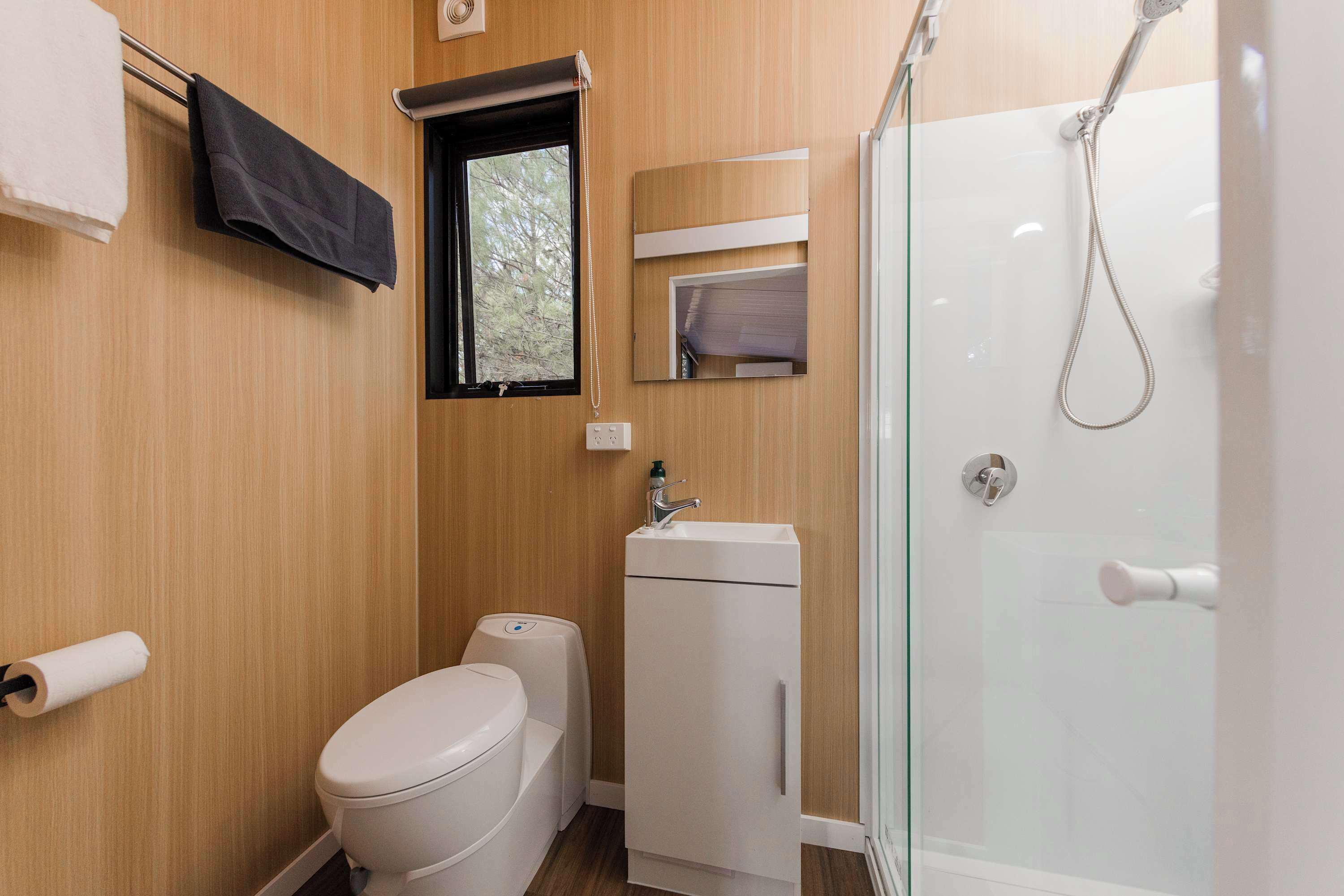 Shower, hair dryer, towels, shampoo