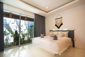 A modern bedroom with a large bed, a sliding glass door to a balcony, and a wall-mounted macrame piece. - Sweet Villa Love Umalas! Breakfast included (Umalas)