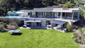 A modern two-story house with a pool, outdoor seating, and a well-maintained lawn. - MAGNIFICENT VILLA WITH SWIMMING POOL AND SEA VIEW FOR 8 GUESTS (GRIMAUD)