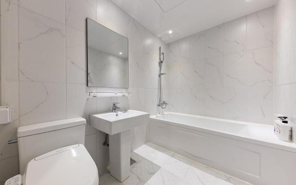 Hair dryer, slippers, towels, toilet paper