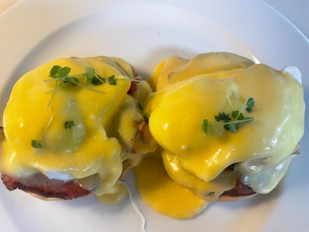 A plate with eggs benedict.