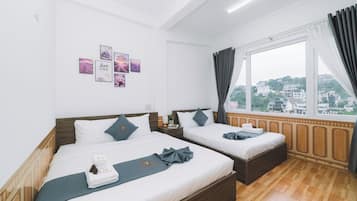 Deluxe Quadruple Room, City View | Iron/ironing board, free WiFi