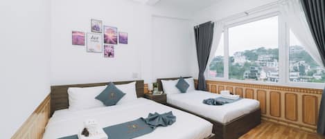 Deluxe Quadruple Room, City View | Iron/ironing board, free WiFi