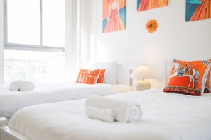 A hotel room with two beds, white bedding, a window, and artwork on the walls. - Hillsdale 3BR|Eastgarden&UNSW with Parking (Hillsdale)