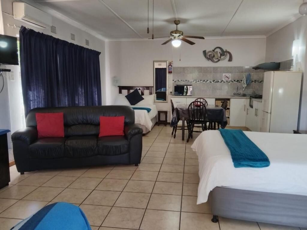 Standard Room, Patio, Pool View | In-room safe, iron/ironing board, free WiFi