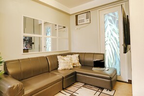 Living area - AR12 H&B Rentals 1Bedroom Unit w/ WiFi Netflix and Free Pool Access (Davao City)