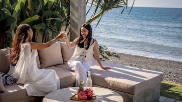 Deluxe Villa, 2 Bedrooms, Patio, Sea View | Living area | 40-inch TV with cable channels
