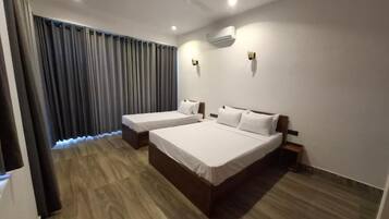 Standard Triple Room, Balcony, Mountain View | Desk, laptop workspace, blackout drapes, iron/ironing board