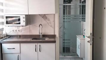 Fridge, microwave, stovetop, coffee/tea maker
