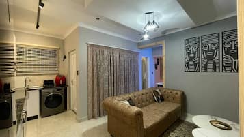 Apartamento, 1 quarto | Sala de estar