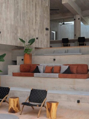 A modern outdoor seating area with a sofa, chairs, and a potted plant. - 2BR Architectural Retreat with Private Pool NEW (Brisas de Zicatela)
