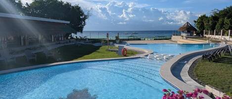 Outdoor pool, open 8:00 AM to 10:00 PM, pool umbrellas, pool loungers