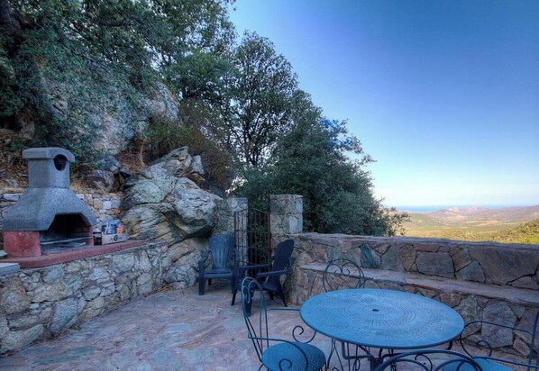 Outdoor dining - A superb view over the Ostriconi valley from this gîte in a typical Balagne village, (LAMA)