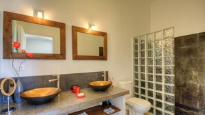 A bathroom with two wooden sinks, a glass shower enclosure, and a mirror above the sink. - Serenity - SOTTA - Gîte (SOTTA)