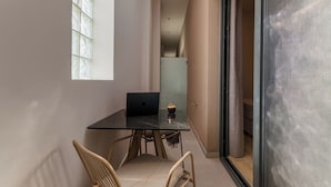 A modern interior with a glass table, a laptop, and two chairs. - Anese Vacation Feelings (Paliouri)