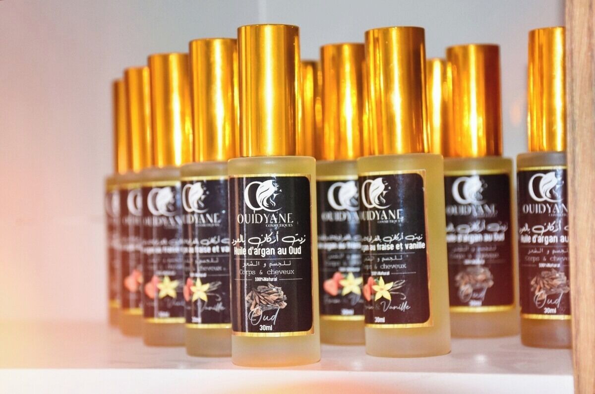 Multiple bottles of OUDYANE hair oil arranged in rows.