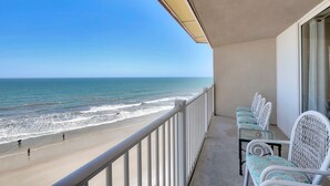 A balcony with a view of the beach and ocean. - 3 Bedroom Point Condo Unit (North Topsail Beach)