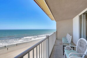 A balcony with a view of the beach and ocean. - 3 Bedroom Point Condo Unit (North Topsail Beach)