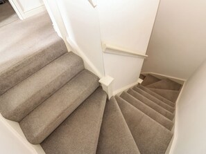A carpeted staircase with white walls and a handrail. - 2 West View (Richmond)