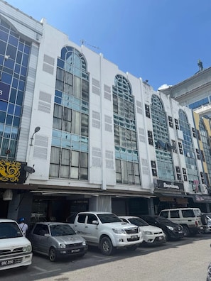 A multi-story building with large windows and a modern architectural design. - Palette - Bukit Mata Boutique Hotel (Kuching)