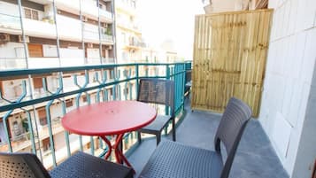 Luxury Triple Room, Balcony | Outdoor dining