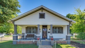 A single-story house with a front porch, a small garage, and a fenced yard. - Quiet Home Near I-49, Downtown & 2 Hospitals (Alexandria)