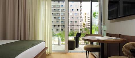 Premium Studio, Balcony | Minibar, in-room safe, desk, laptop workspace