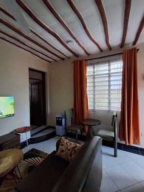 Classic Apartment | Living area | 24-inch Smart TV with digital channels - Makey Holiday Homes Diani (Diani Beach)