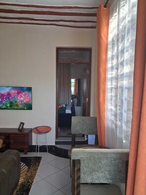 Classic Apartment | Living area | 24-inch Smart TV with digital channels - Makey Holiday Homes Diani (Diani Beach)