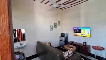 Classic Apartment | Living area | 24-inch Smart TV with digital channels