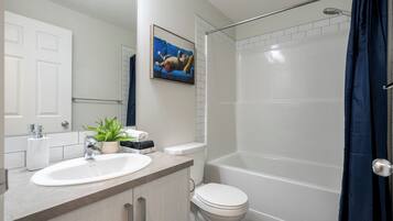 Shower, hair dryer, towels, shampoo