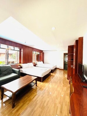 Habitación cuádruple Deluxe | Interior