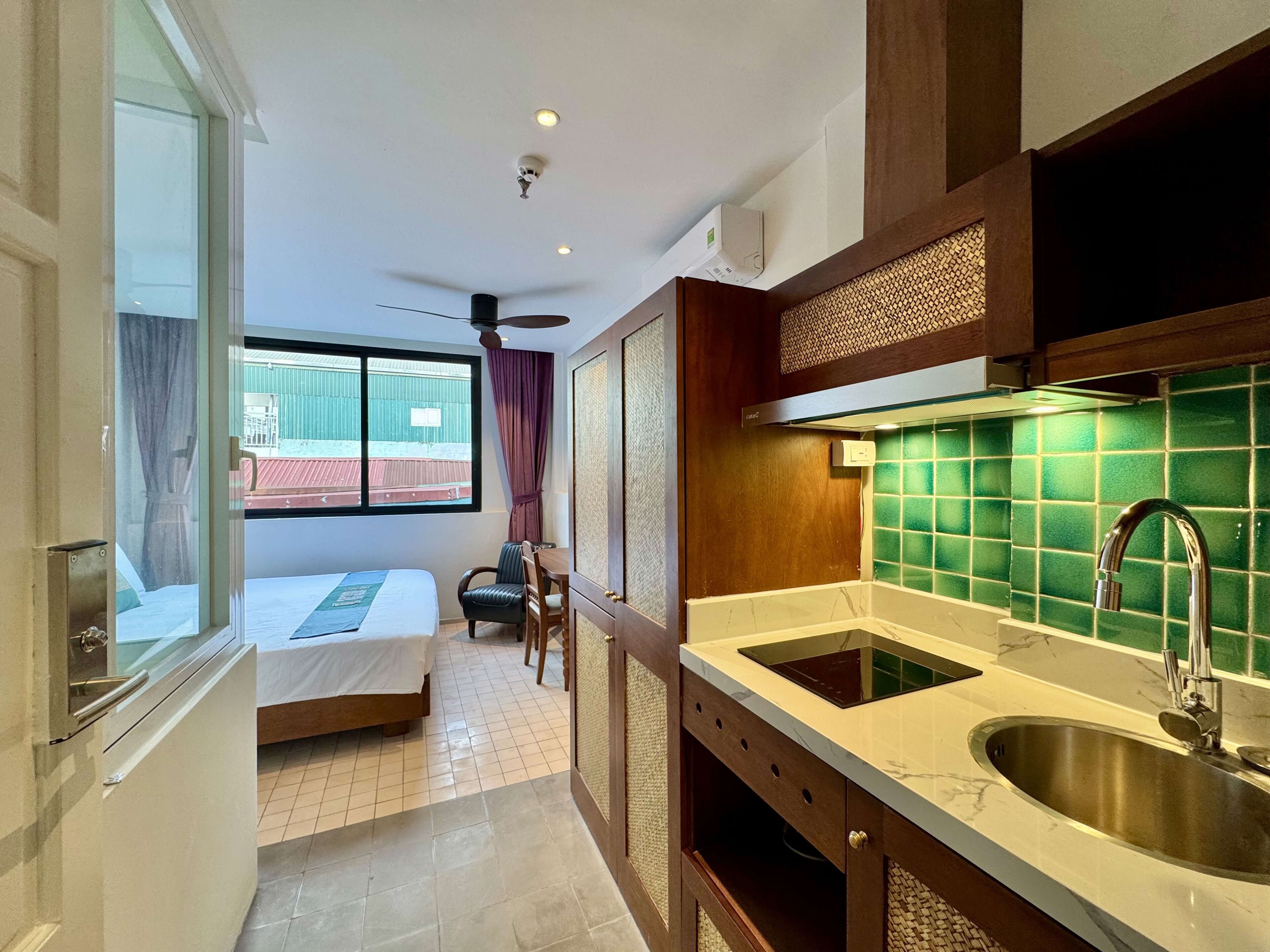 Basic Studio, City View | Desk, laptop workspace, blackout drapes, iron/ironing board