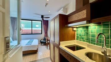 Basic Studio, City View | Desk, laptop workspace, blackout drapes, iron/ironing board