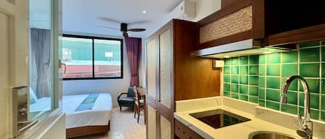 Basic Studio, City View | Desk, laptop workspace, blackout drapes, iron/ironing board