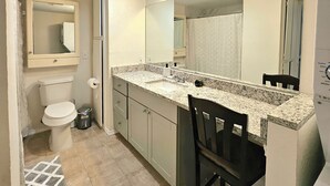 A compact bathroom with a toilet, sink, and mirror. - 4min to World Cup Stadium/Dallas Stadium - 0.9 mile from AT&T Stadium Arlington (Arlington)