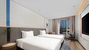 A hotel room with two beds, a desk, a TV, and a window with a city view. - Holiday Inn Express Shanghai Jing An Xikang Road By Ihg (Shanghai)