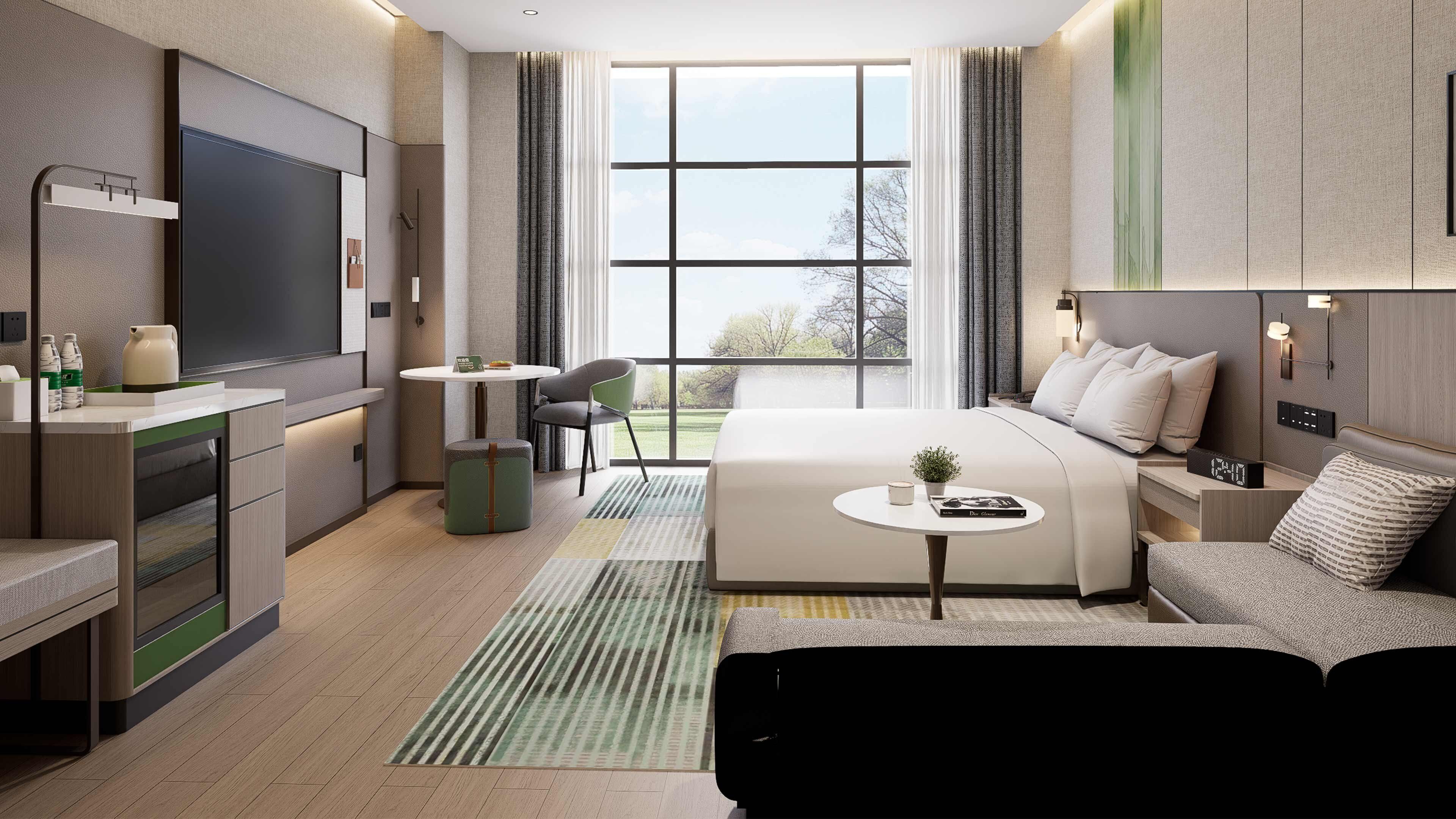 A modern hotel room with a large bed, a desk, a chair, a TV, and a window with a view of trees.