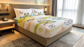 A hotel room with a bed, bedside tables, a phone, and a window with curtains.