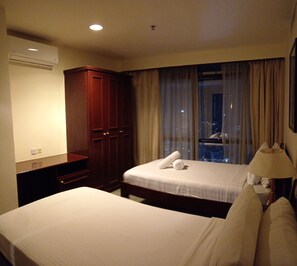 Family Double Room, City View | Iron/ironing board, free WiFi - Berjaya Times Square Apartment (Kuala Lumpur)